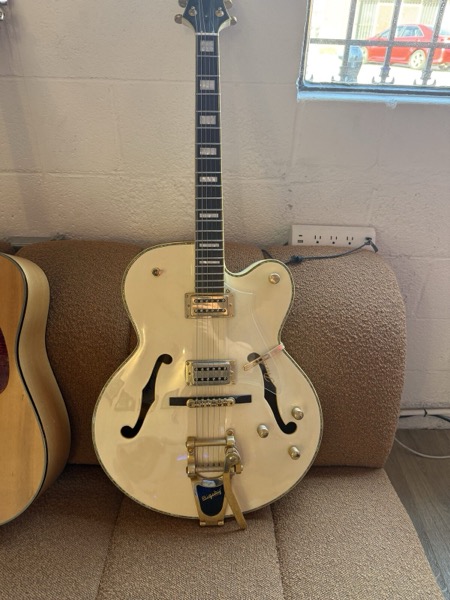 Cream hollowbody electric with Bigsby