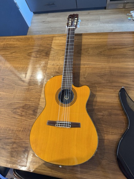Amber cutaway nylon-string, bowl back