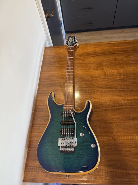 Washburn electric, blue-green quilted top